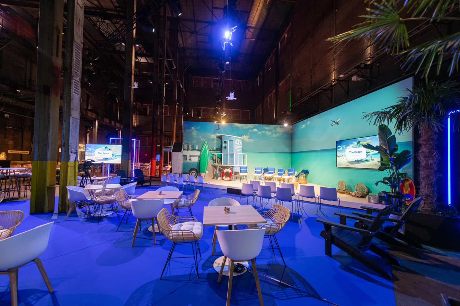 Modern indoor lounge with seating and tropical decor at SugarFactory.